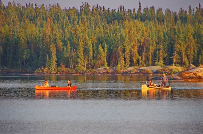 "Watching as a party of three canoes paddled in on a Friday night"