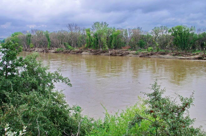 You can paddle the Assiniboine River - but there's a lot of debris from earlier floods along its banks