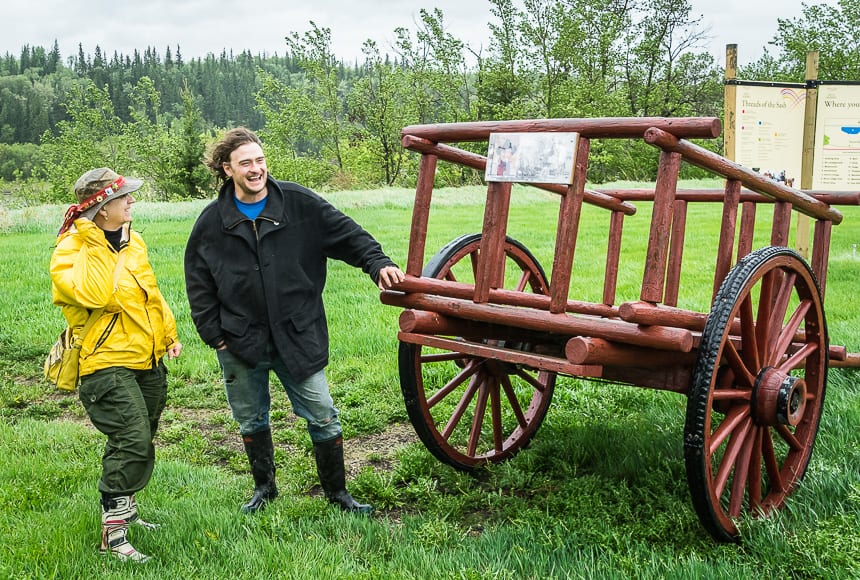 Admiring a Red River cart at a stop in Metis Crossing - a National Historic Site while exploring Alberta's Iron Horse Trail